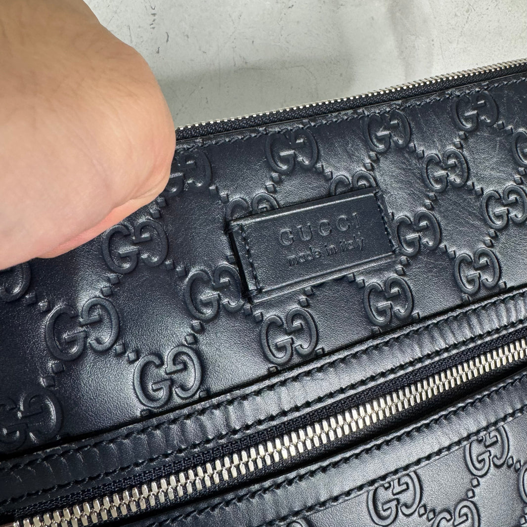 Gucci Monogram Embossed Messenger Bag