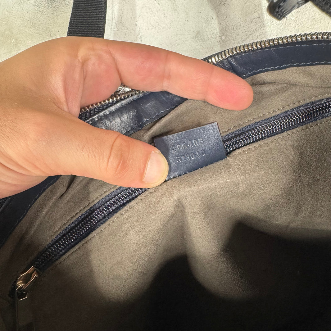 Gucci Monogram Embossed Messenger Bag