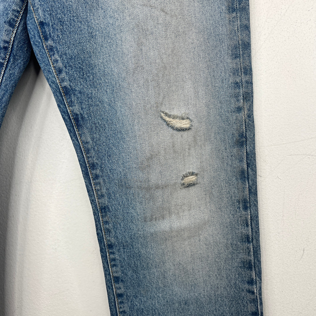 424 Distressed Light Wash Denim Jeans