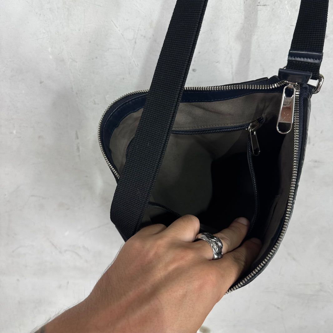 Gucci Monogram Embossed Messenger Bag