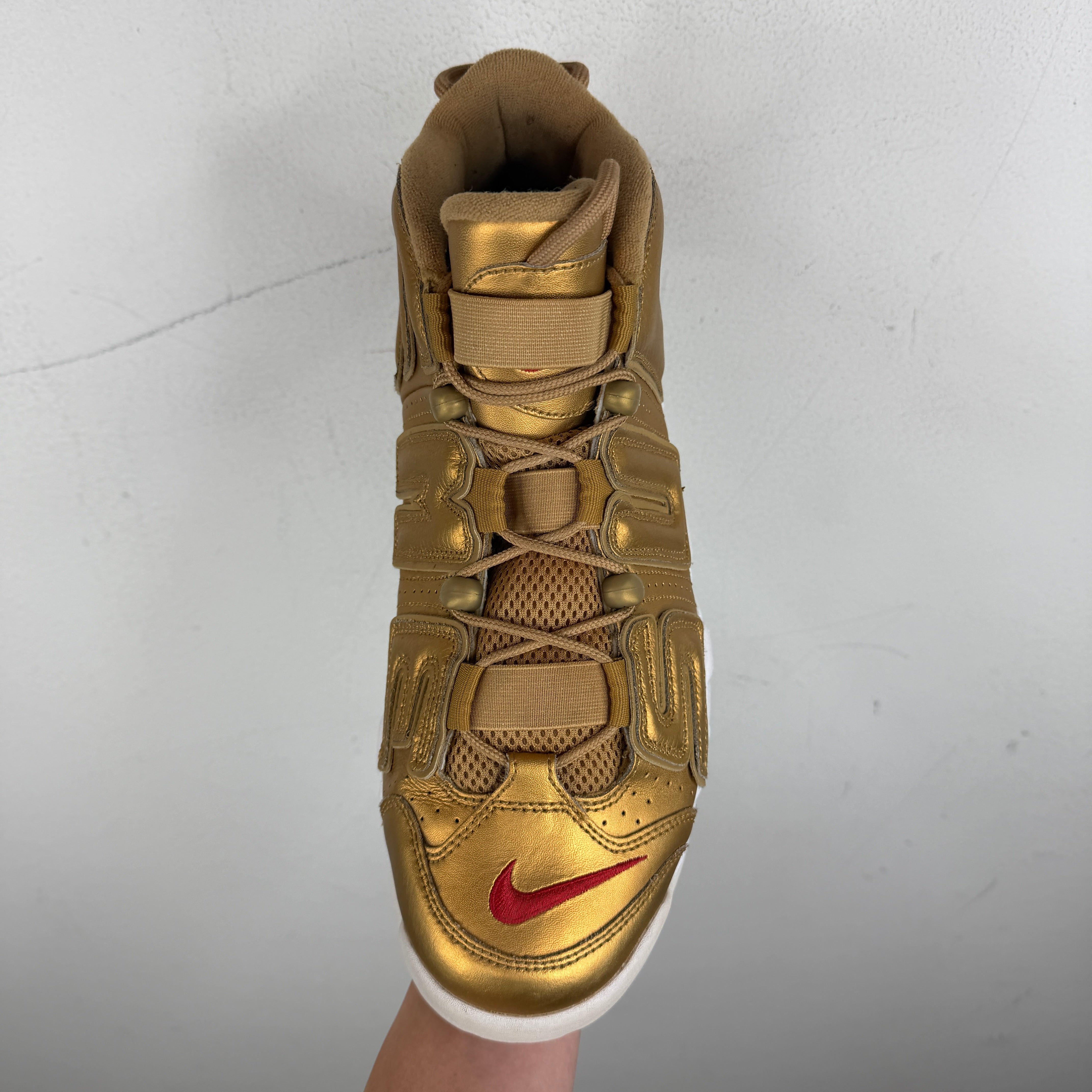 gold supreme nike