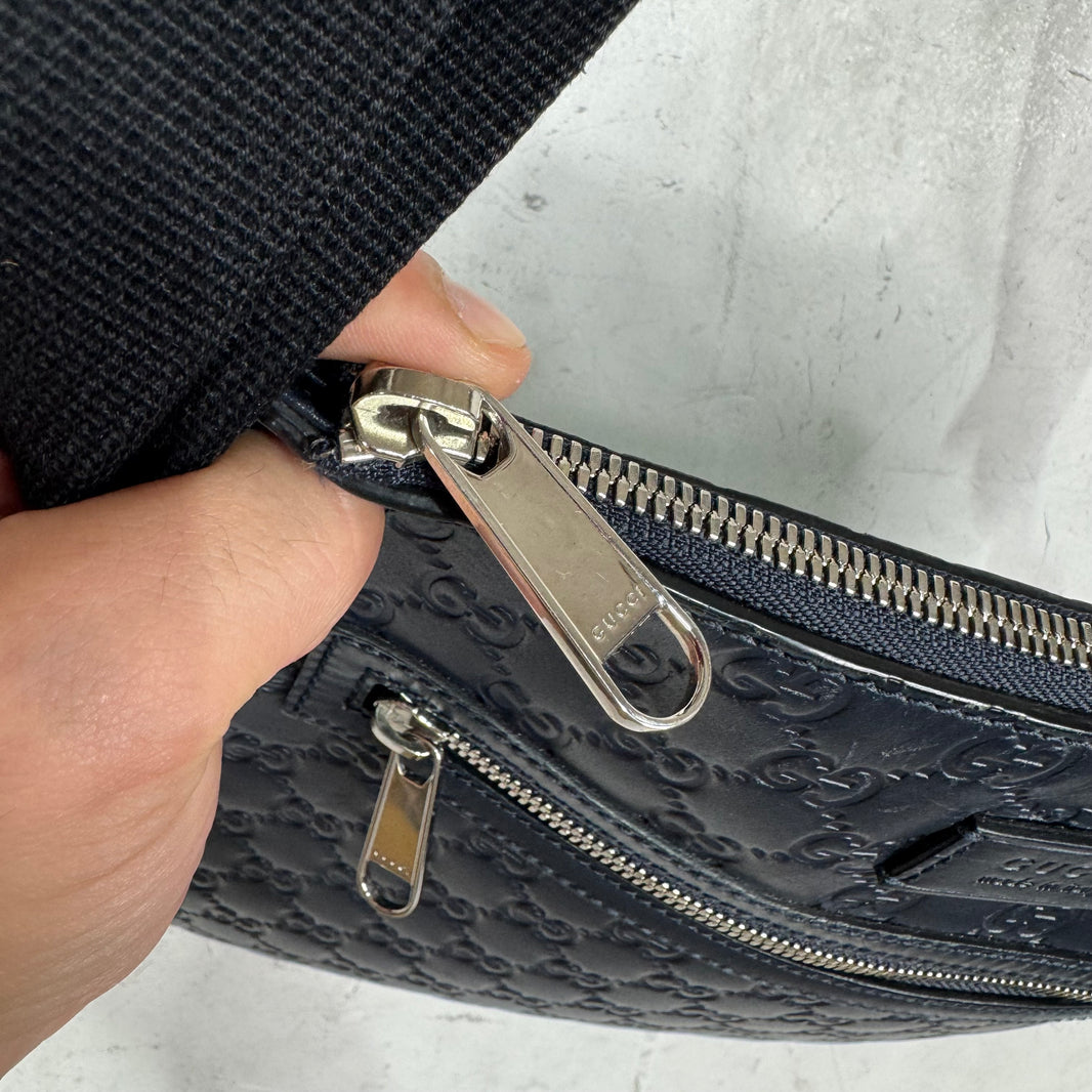 Gucci Monogram Embossed Messenger Bag