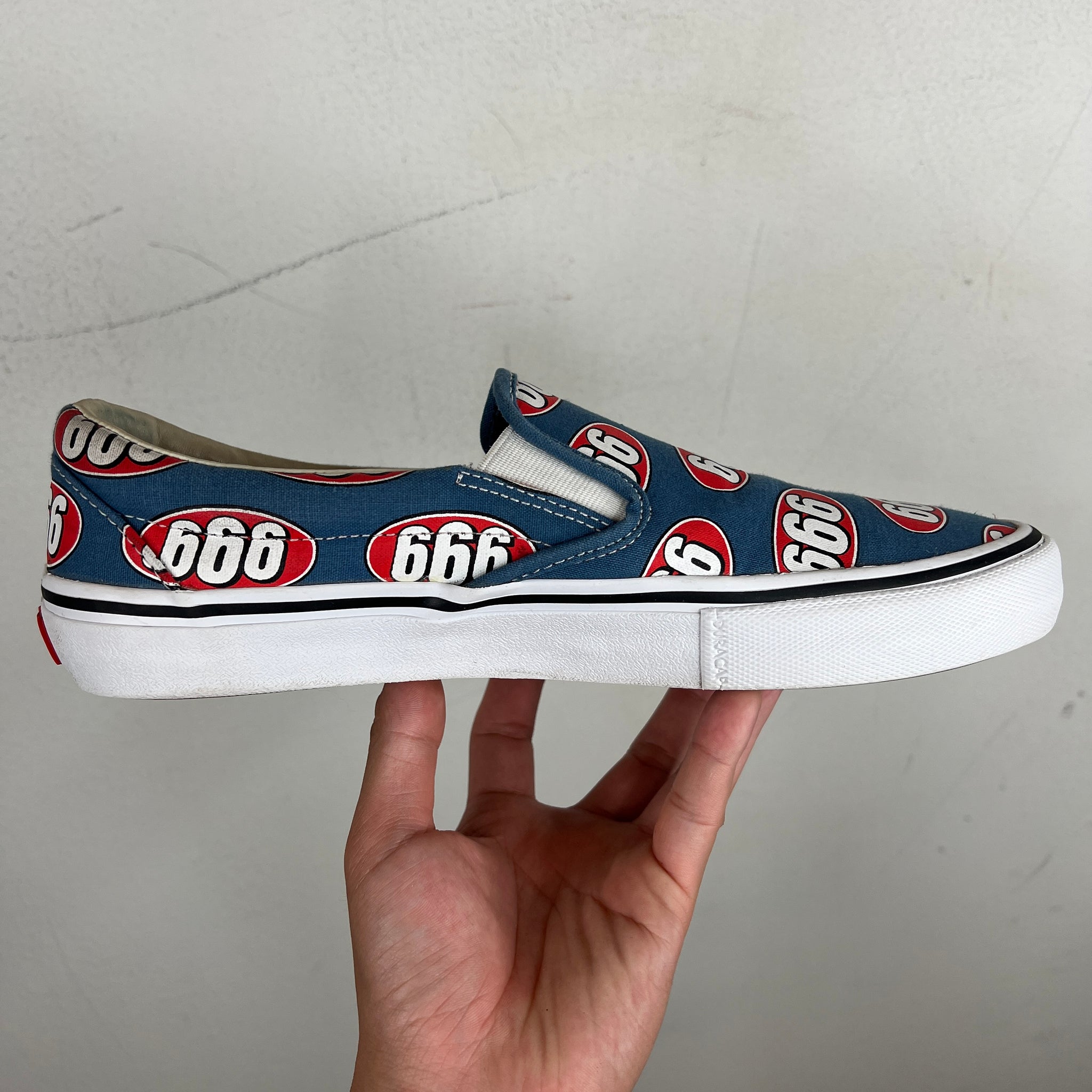 Supreme vans slip ons on sale