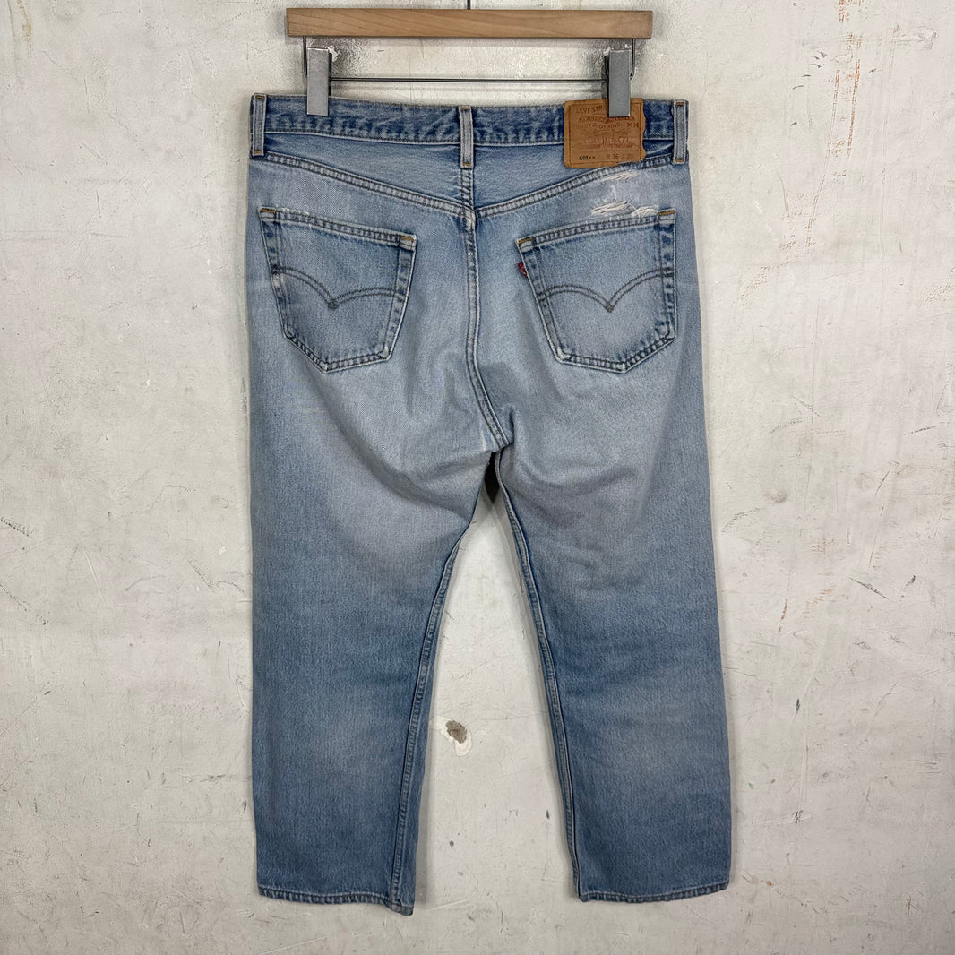 Vintage Levis 501xx Medium Wash Ripped Jeans