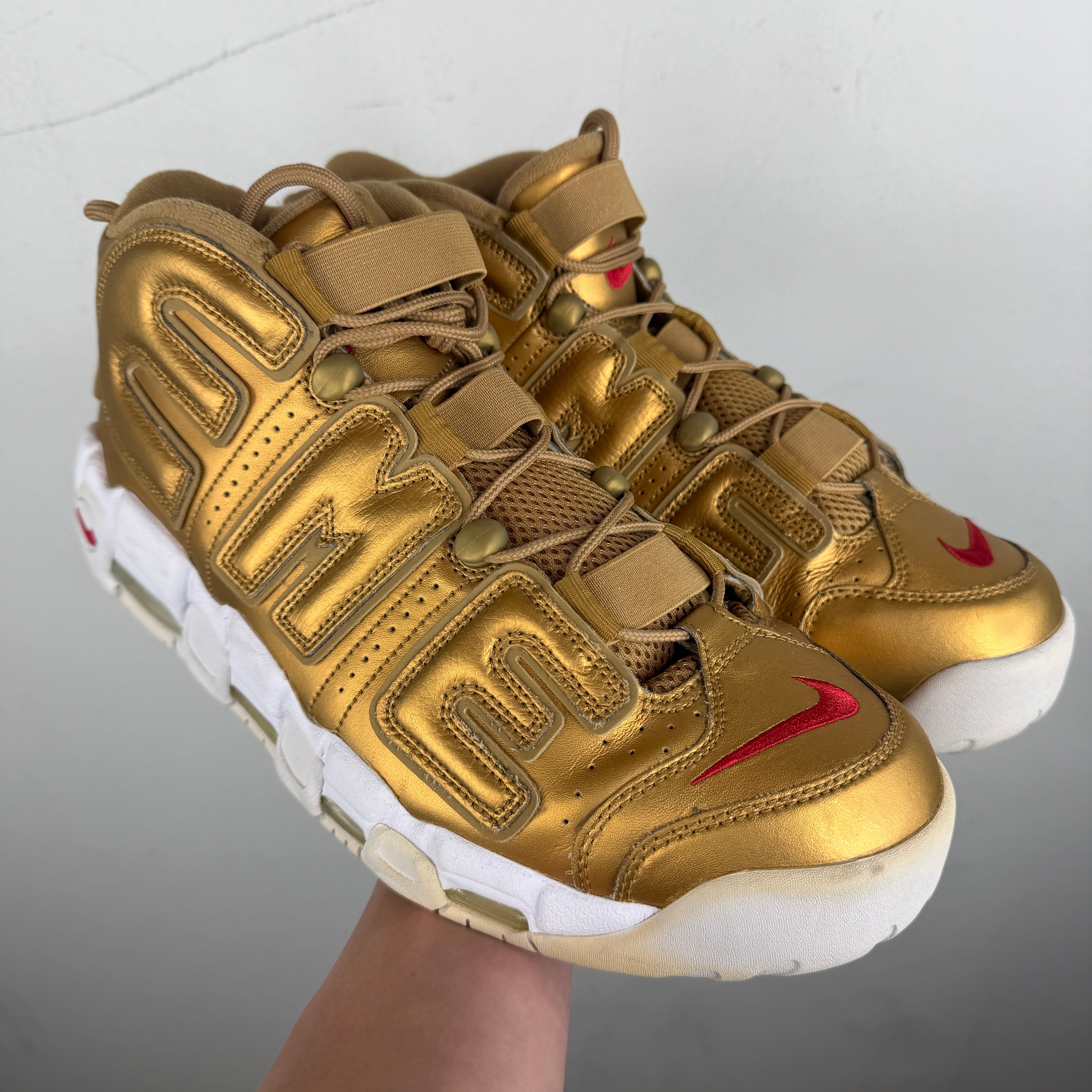 gold supreme nike